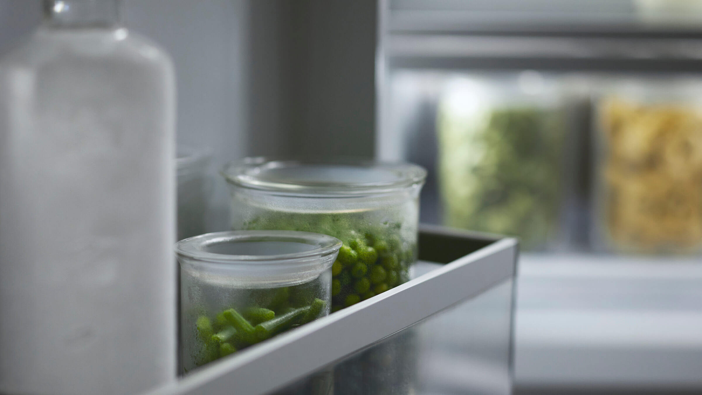 Close-up of items in a freezer drawer showing efficient organization and cooling