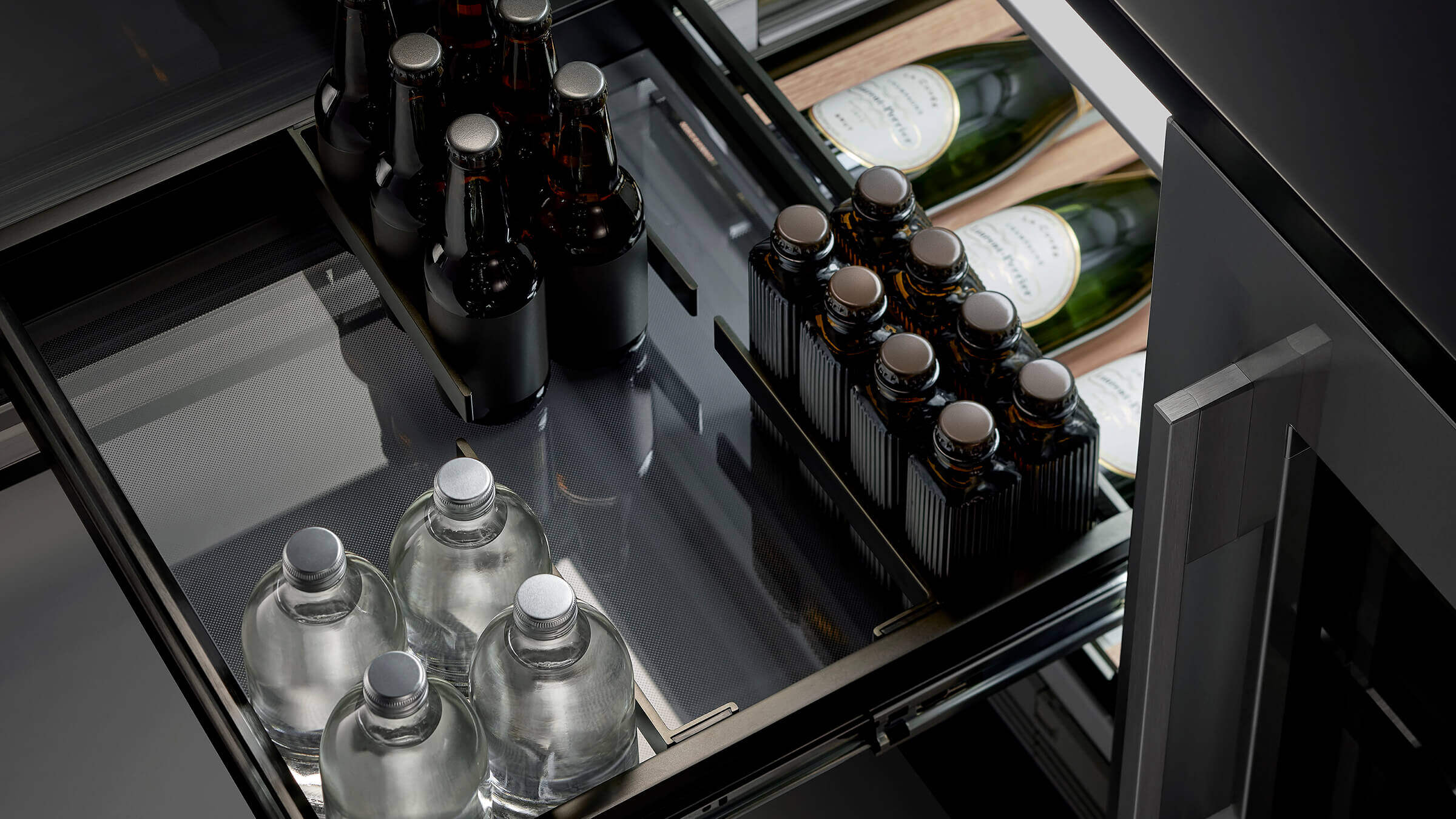 A black stainless steel Quad Door refrigerator with recessed handles, designed for effortless use