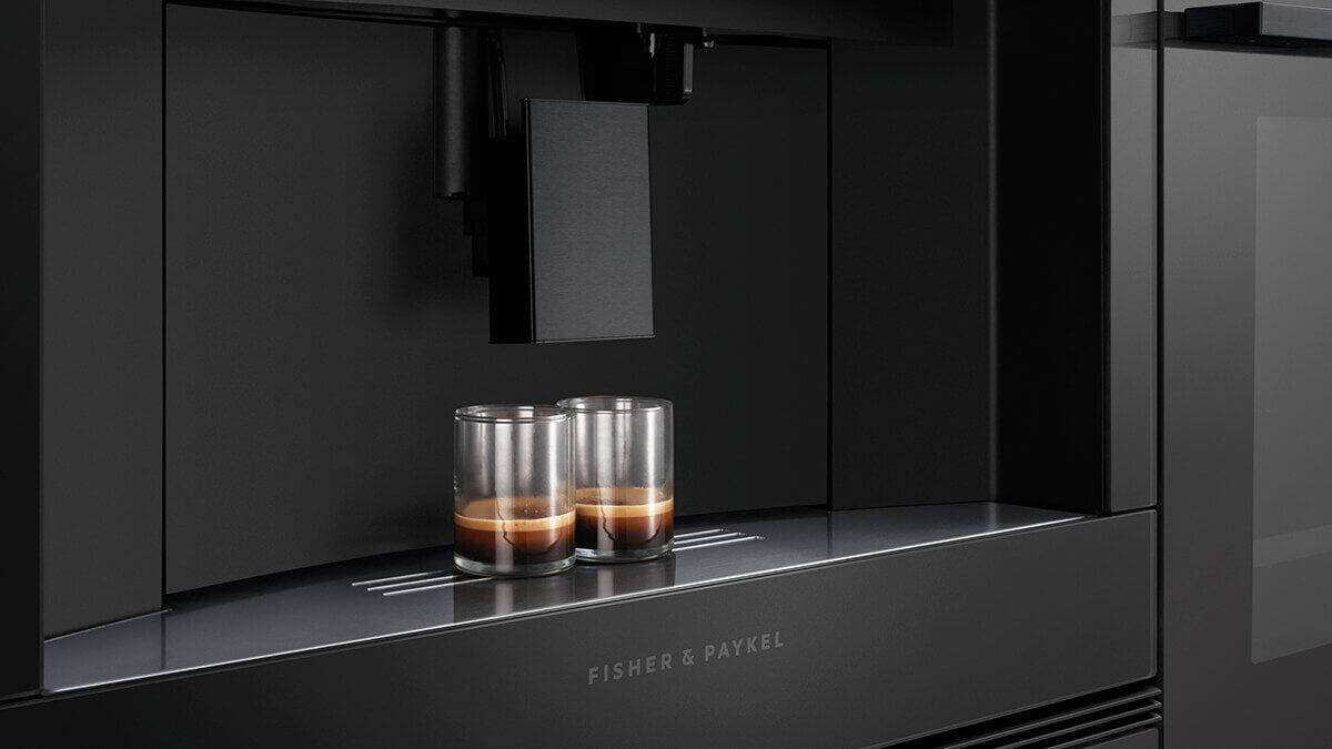 Built-in coffee maker brewing espresso with controlled pressure and temperature