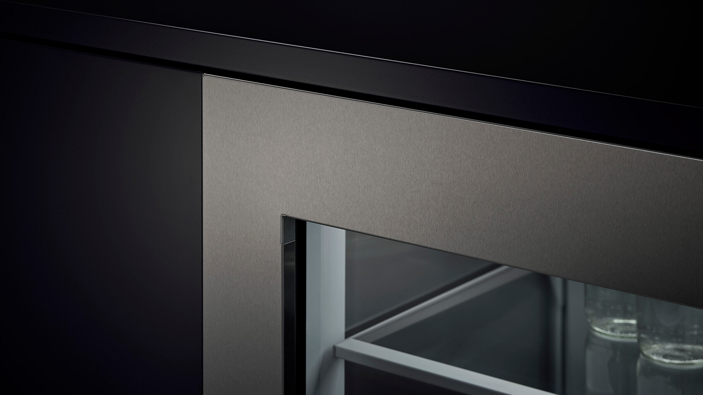 Detail of the flush cabinetry installation of an integrated wine column