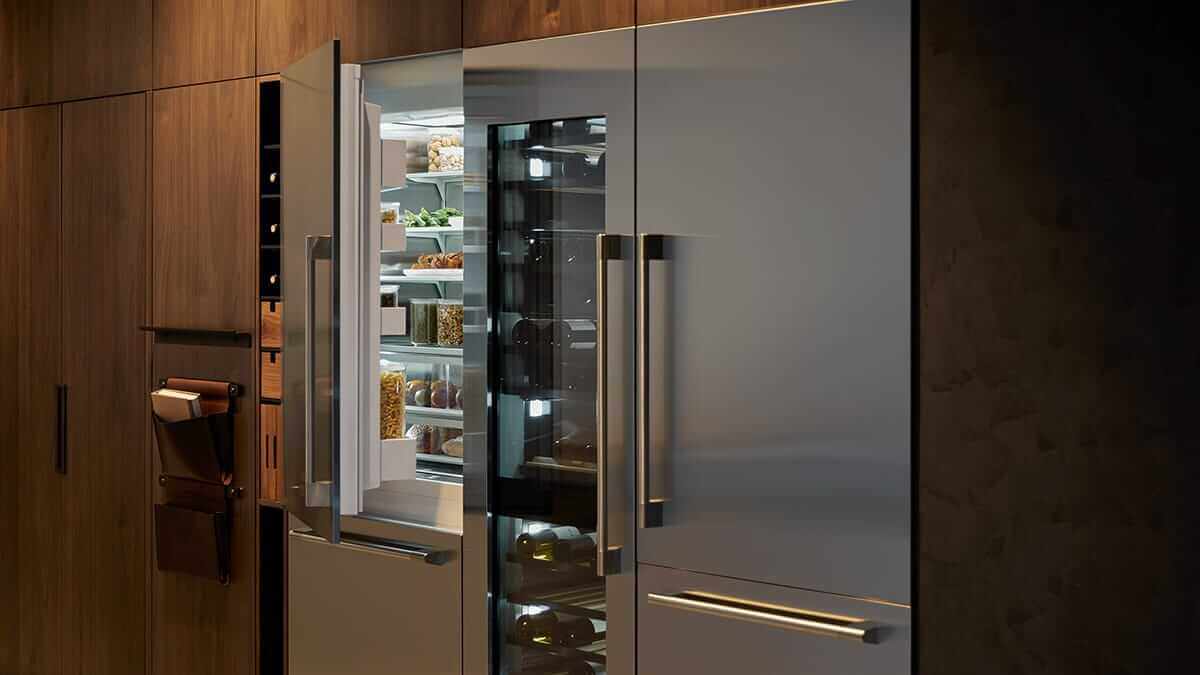 Kitchen interior showing a stainless steel refrigerator column paired with other professional appliances
