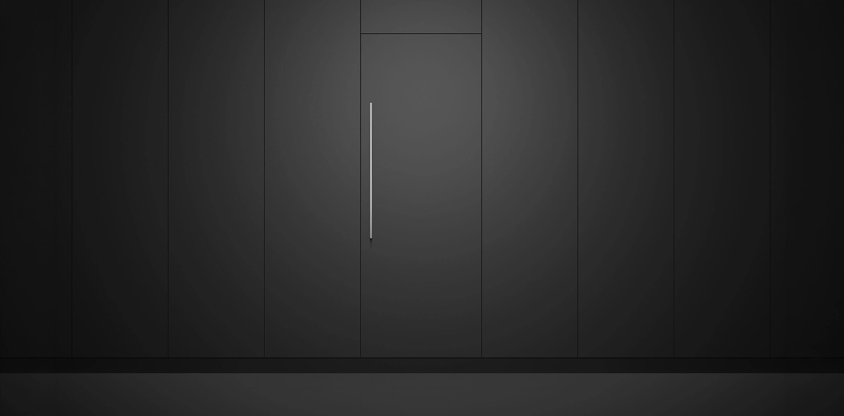 Integrated vertical refrigeration columns installed flush with custom dark cabinetry