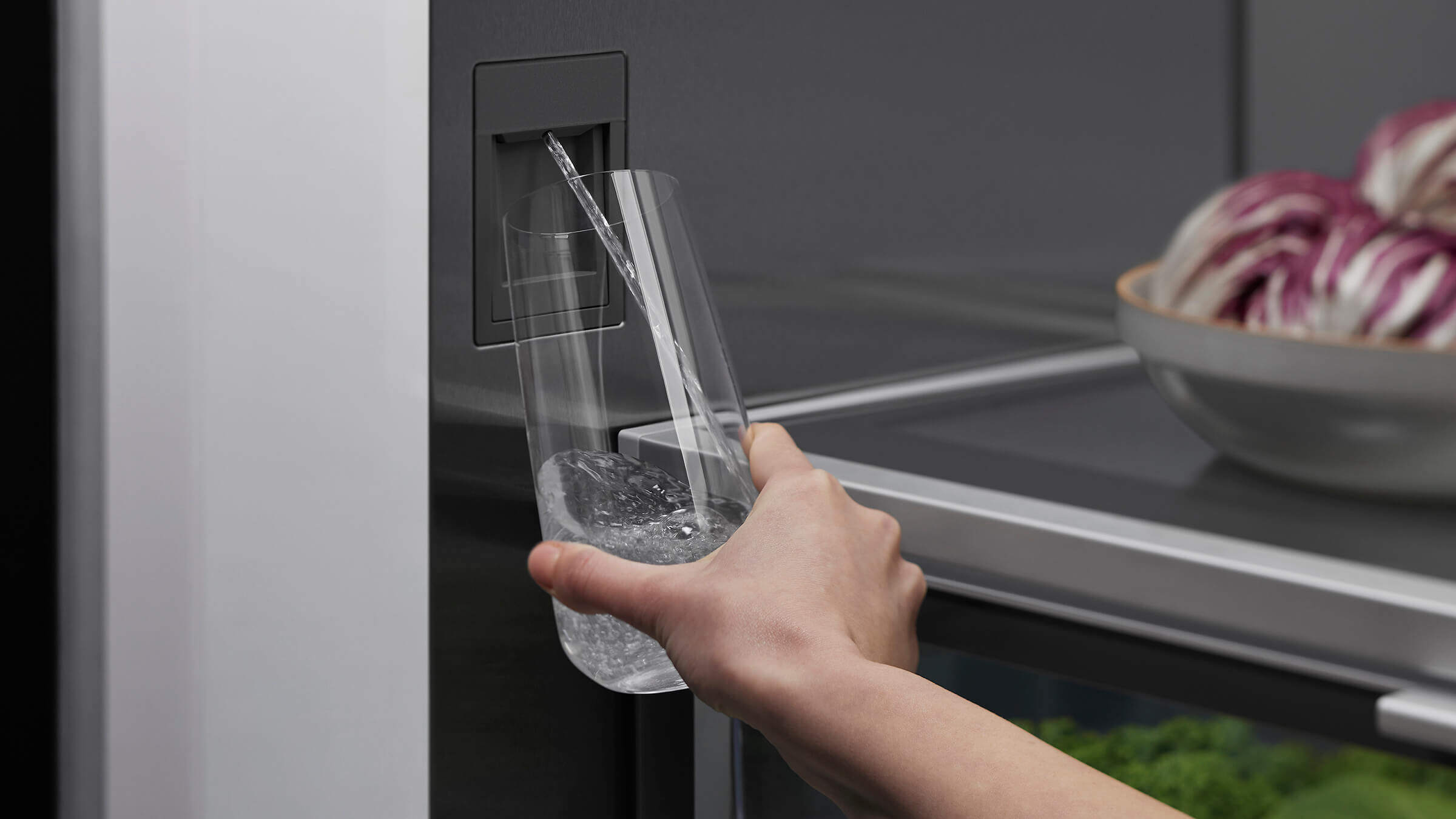 discreet internal water dispenser integrated into the refrigerator column