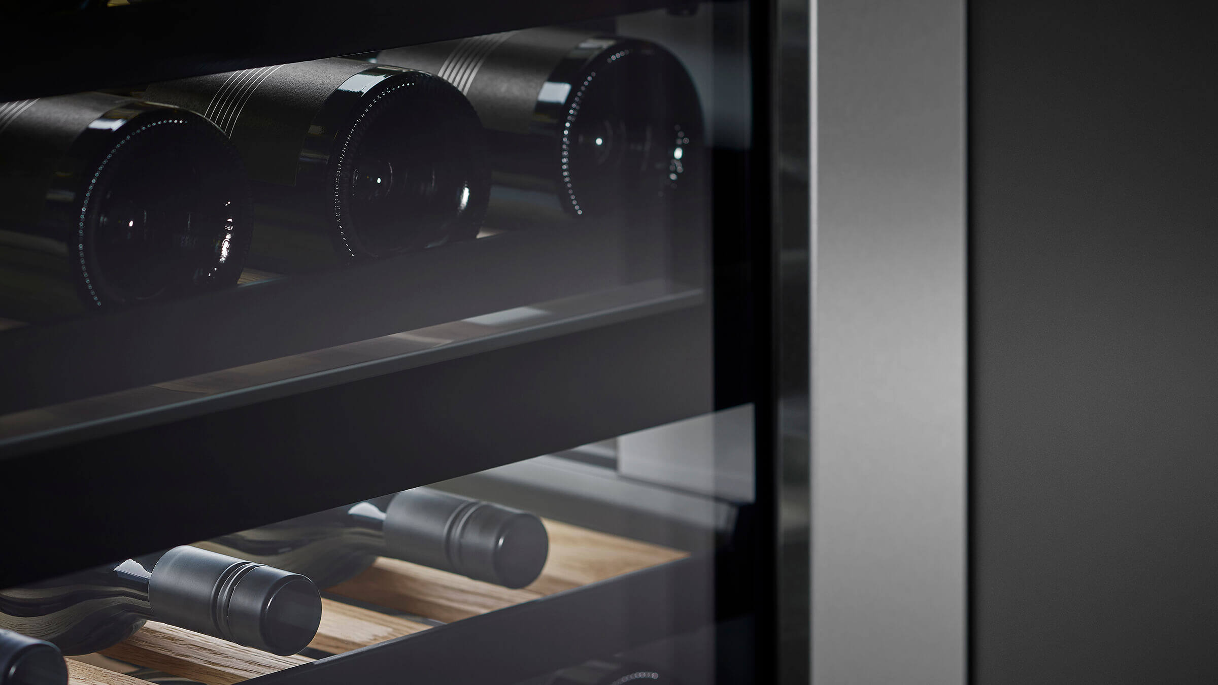 Tinted UV-protective glass door shielding wine bottles