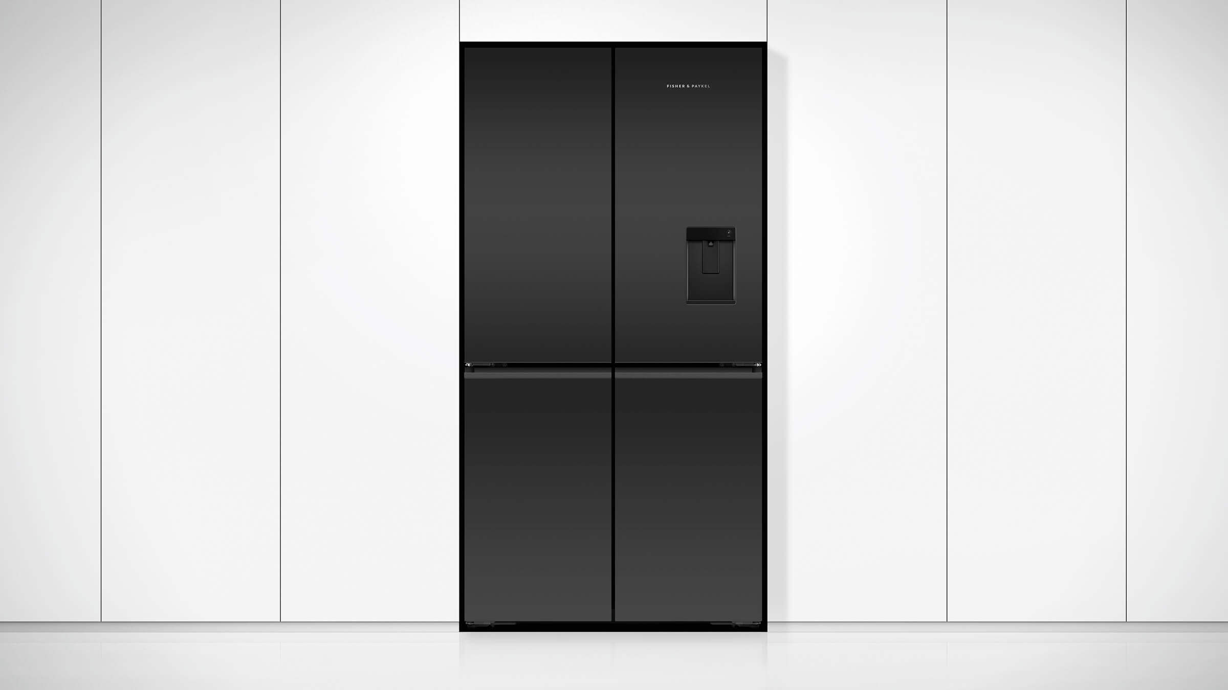 A minimal black stainless steel Quad Door refrigerator within sleek kitchen cabinetry