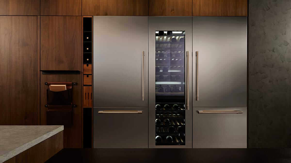 Professional-style kitchen with dual stainless steel refrigerator columns and custom handles