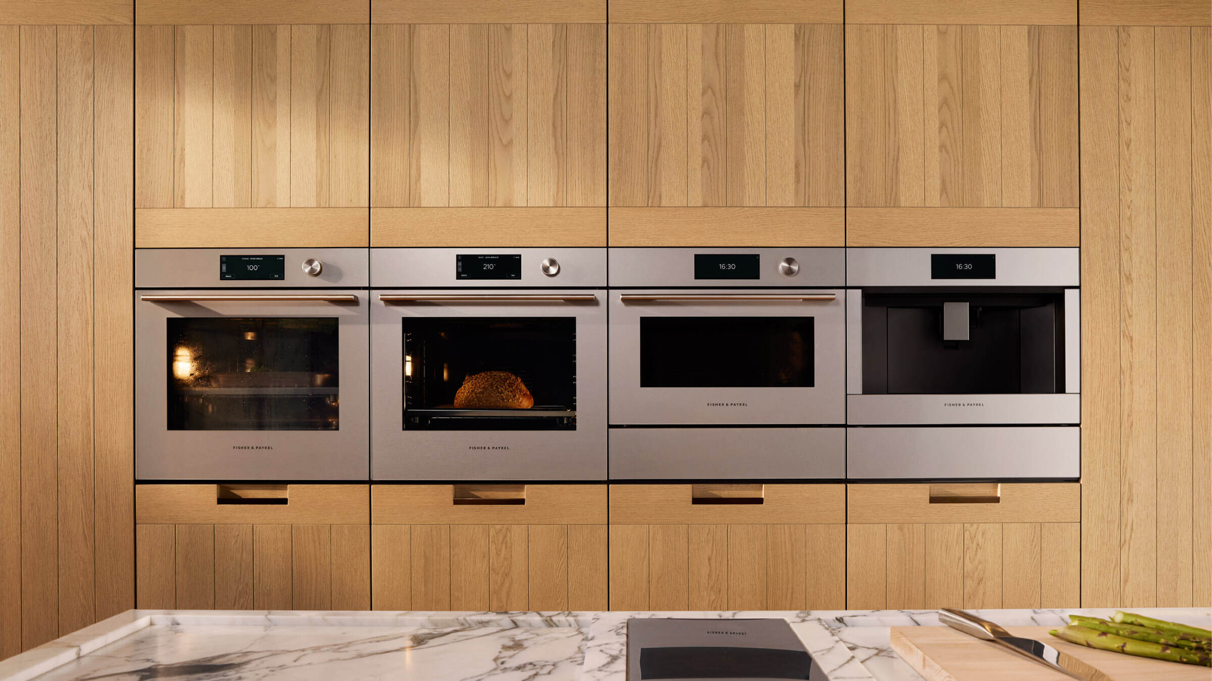 Warming drawer and coffee maker integrated flush with surrounding cabinetry