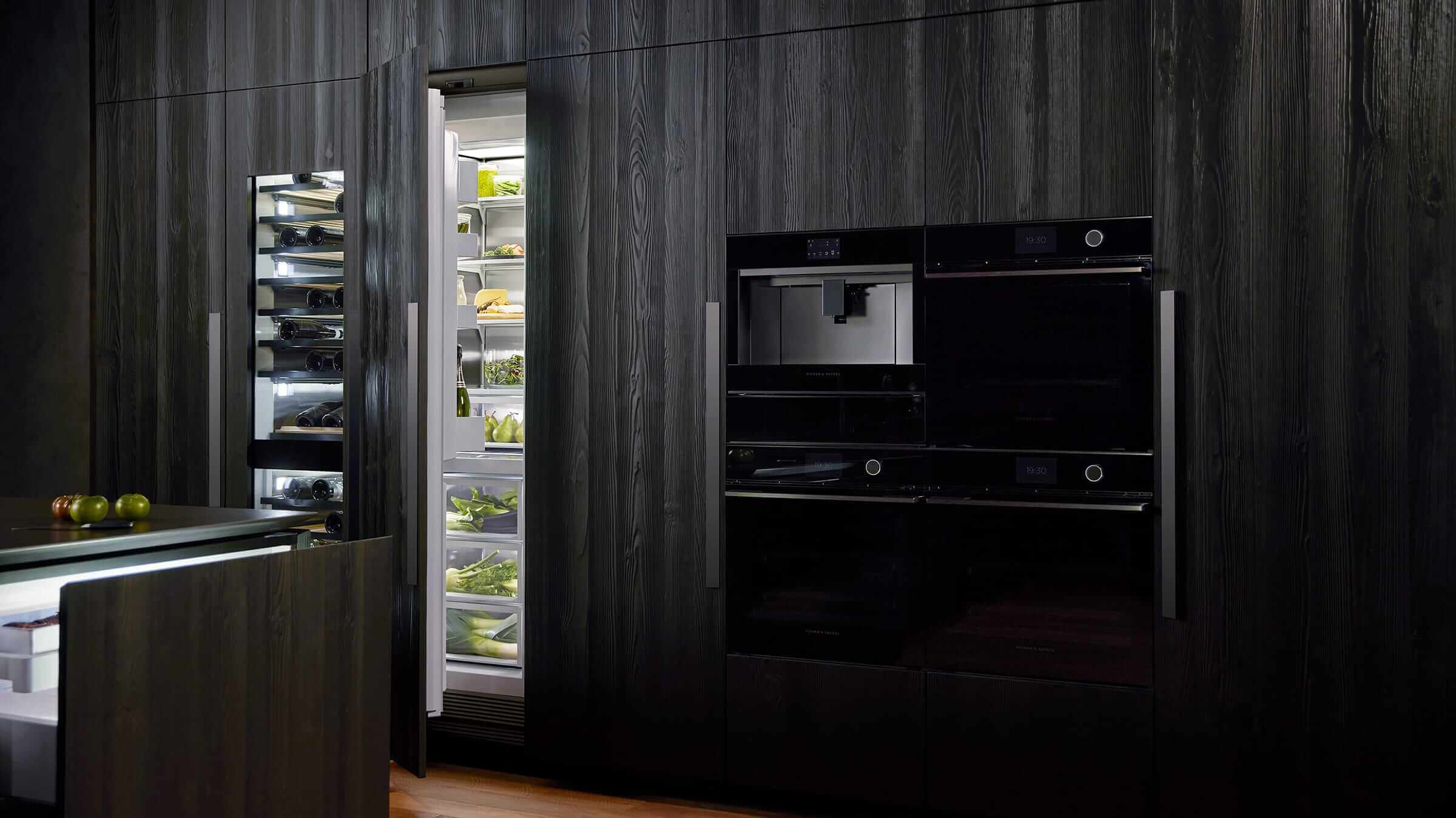 Minimalist kitchen featuring seamlessly integrated vertical refrigeration columns