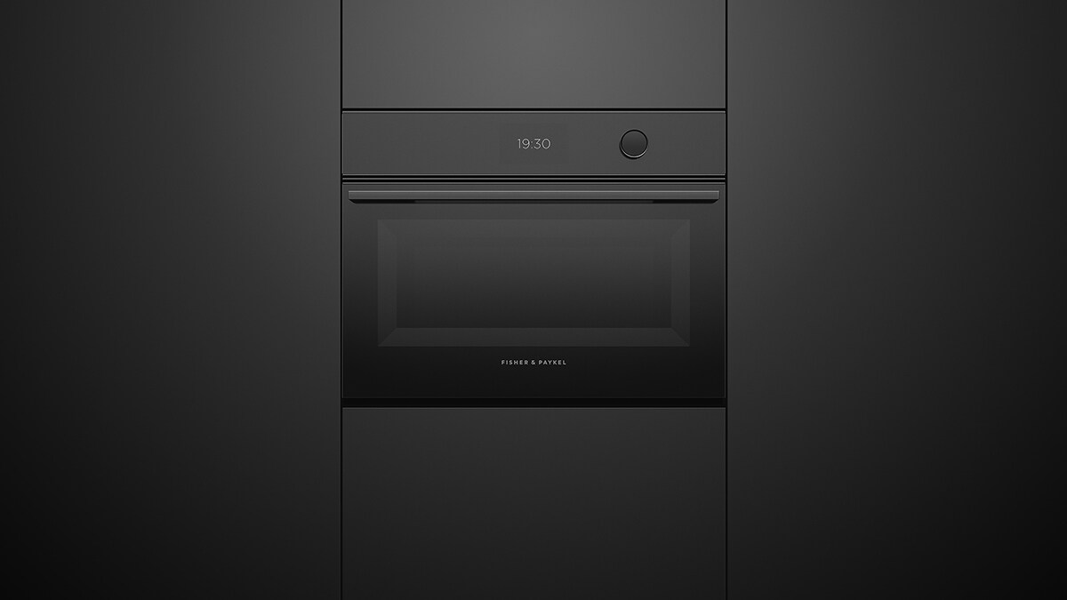 Built-in Convection and Steam Combo Oven Integrated Set into Black Cabinetry.