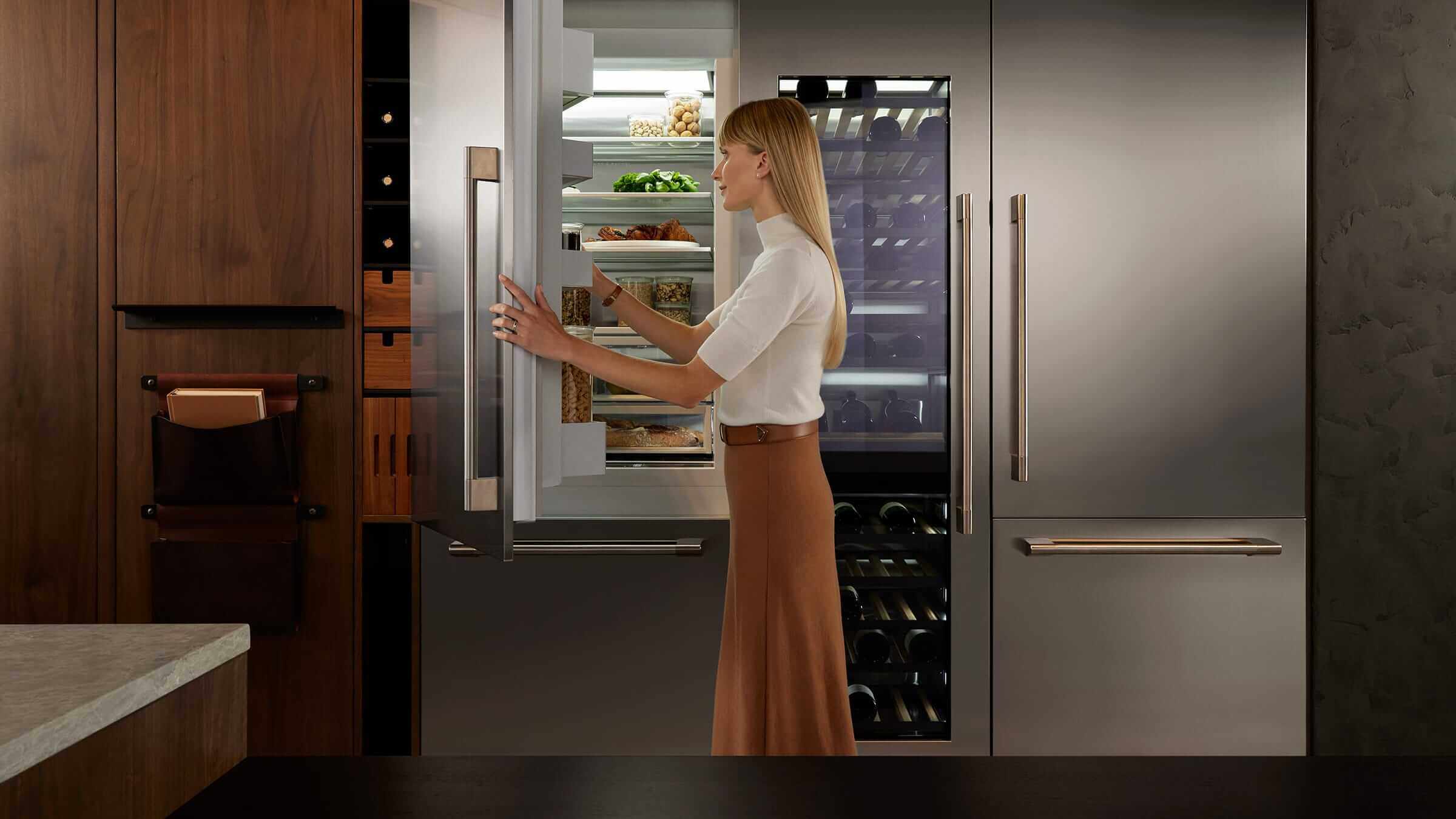 Professional-style kitchen with large stainless steel refrigerator columns