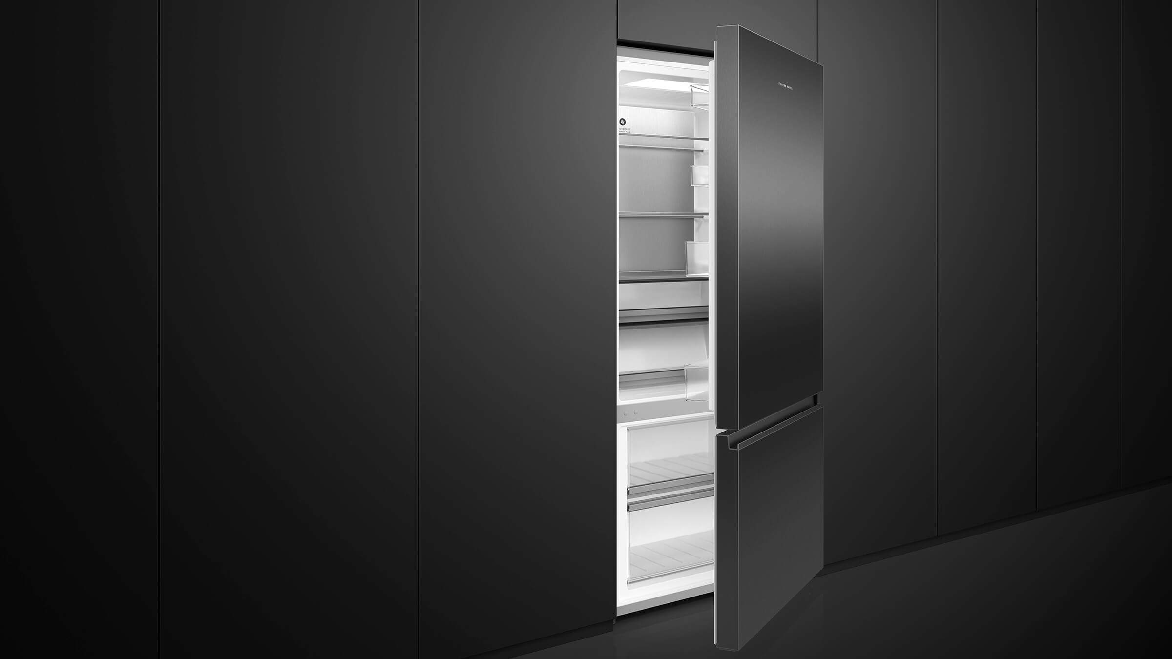 A stainless steel bottom freezer refrigerator in a contemporary kitchen setting