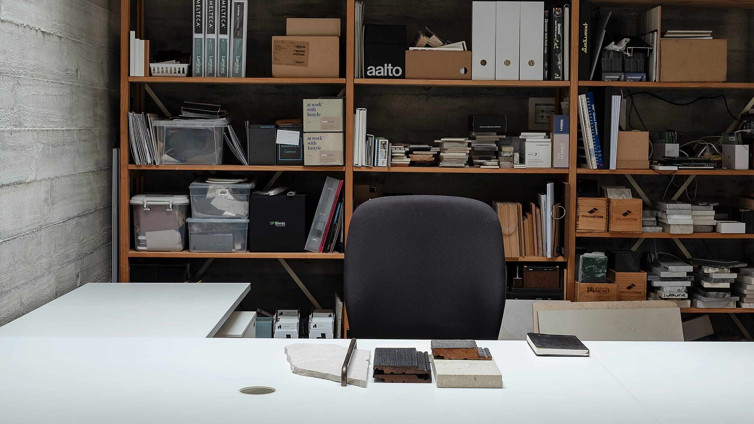 Office desk space with shelving behind